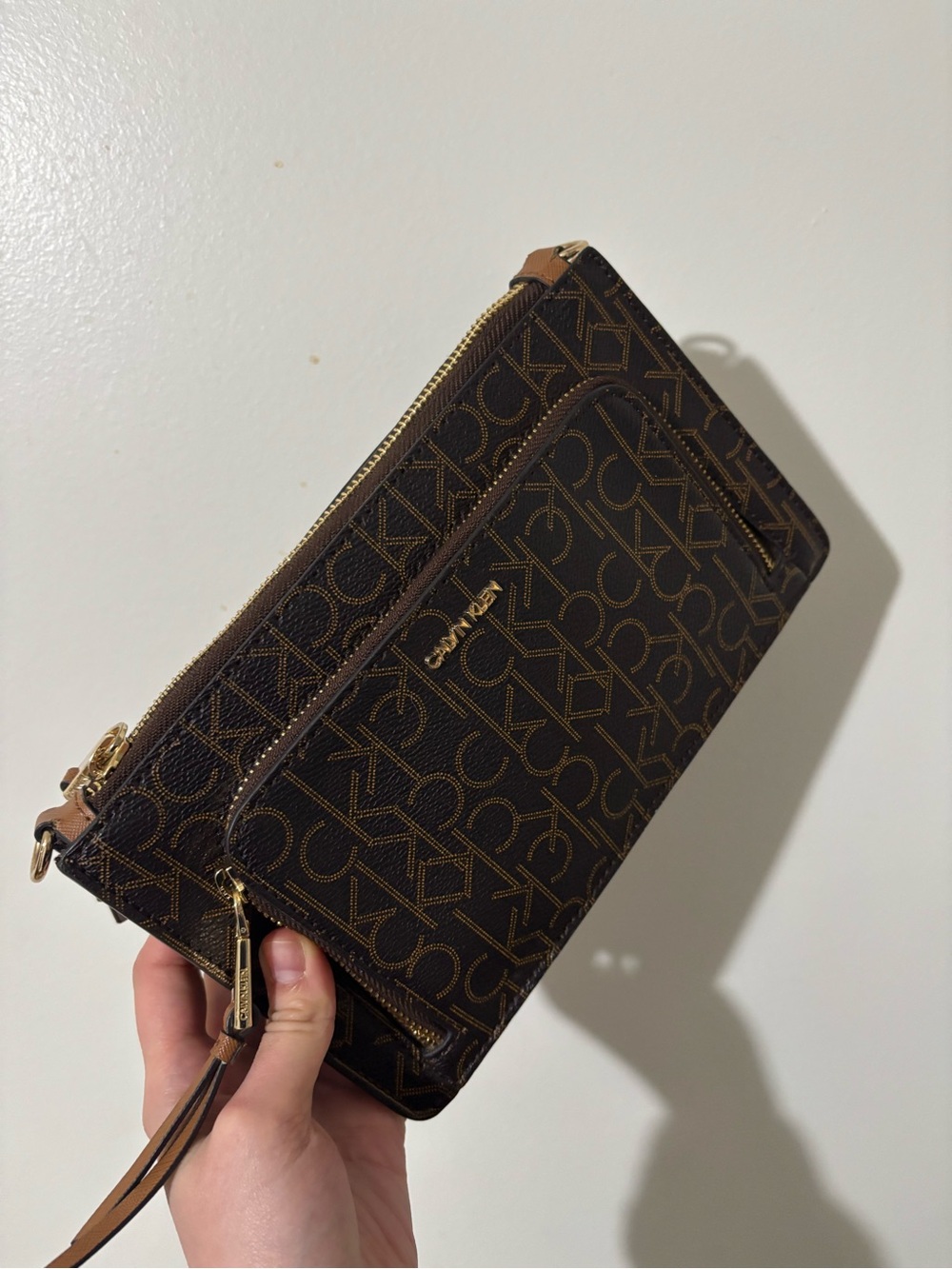 Calvin Klein  Dark Brown Signature Logo Wristlet with Gold Hardware